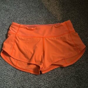 Highlight orange lululemon shorts